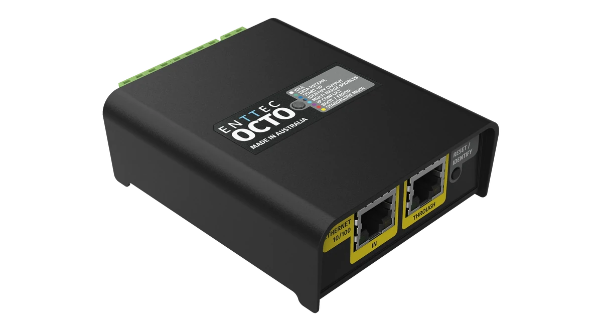 OCTO 的斜俯视图，顶盖印有“ENTTEC OCTO, MADE IN AUSTRALIA”，旁边是灰色 LED 图例；近侧面为黄色 ETHERNET 10/100 IN 和 THROUGH RJ45 插座以及 RESET / IDENTIFY 按钮，远侧边缘为绿色螺丝端子。